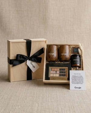 Luxury Corporate gifts Dubai & Business Gift Boxes featuring a wooden gift box with branded items from Google.