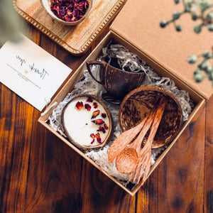 Minimal & Sustainable Gifts - eco-friendly gift box with candle, bowl, and wooden utensils.