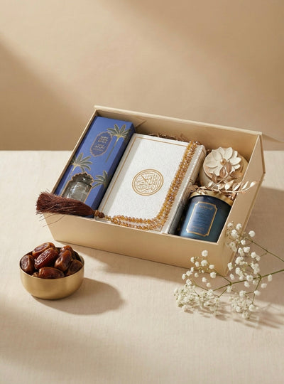 Luxury Ramadan gifts UAE in a beautifully arranged gift box with a scented candle, Quran, and dates.