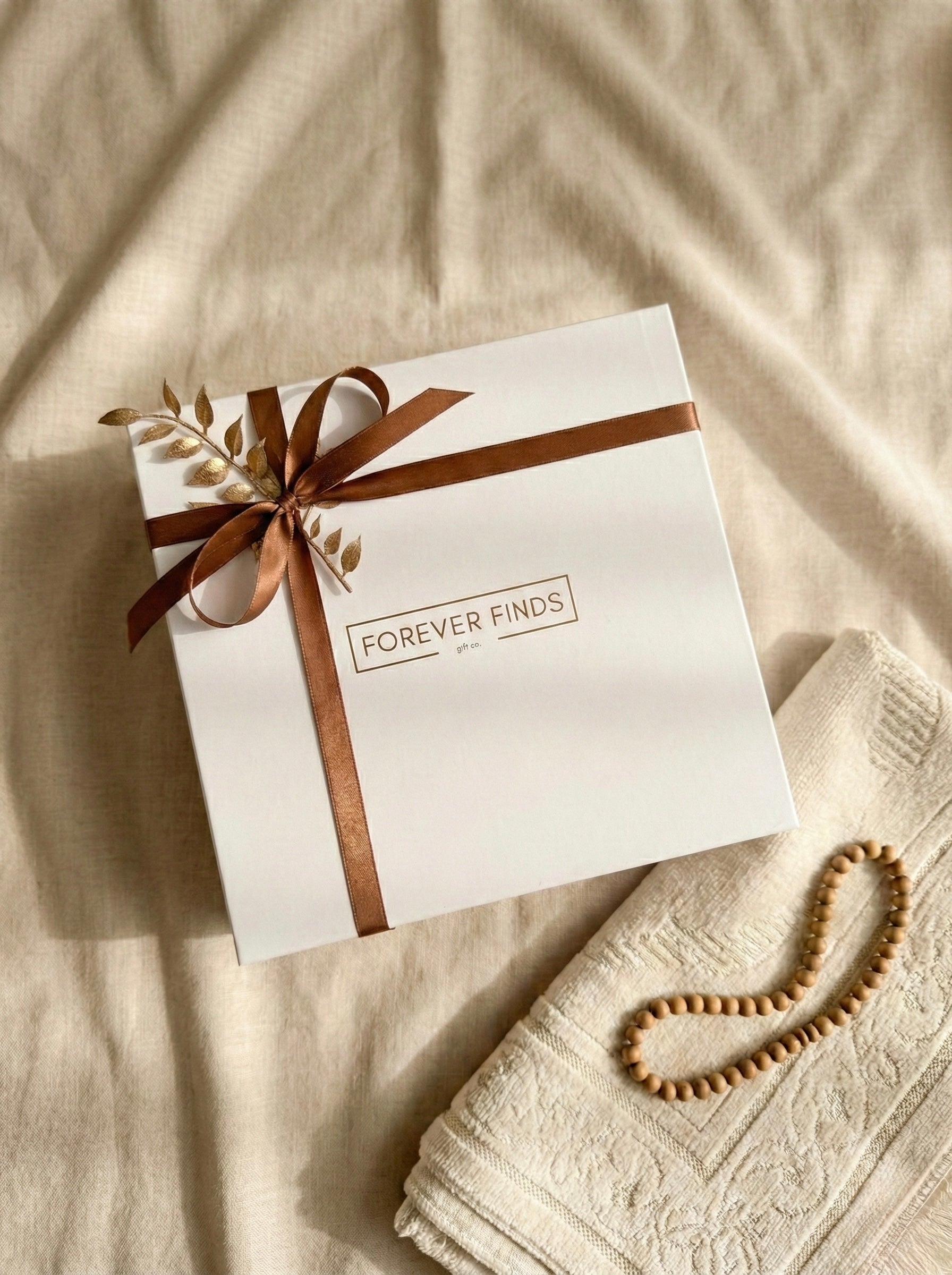 The Sunset Ritual Box beautifully packaged with a brown ribbon, perfect for gift-giving or personal use.
