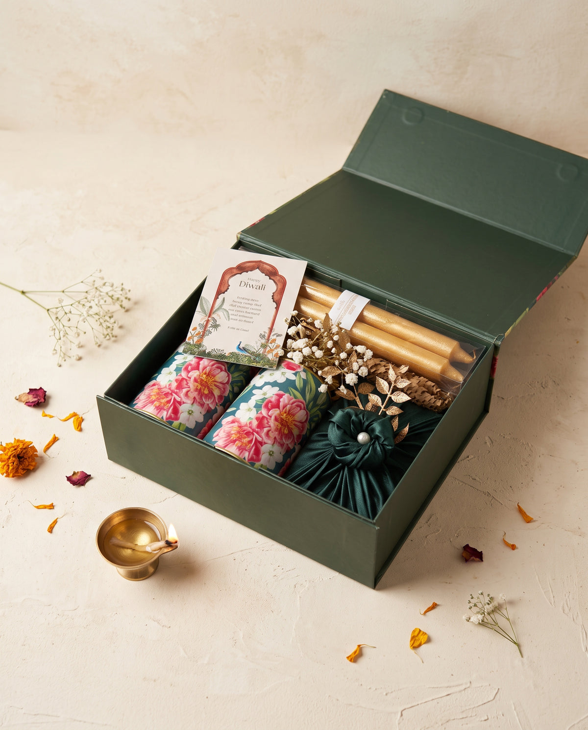 Emerald Bloom Diwali Box with candles and floral decor for a festive celebration.