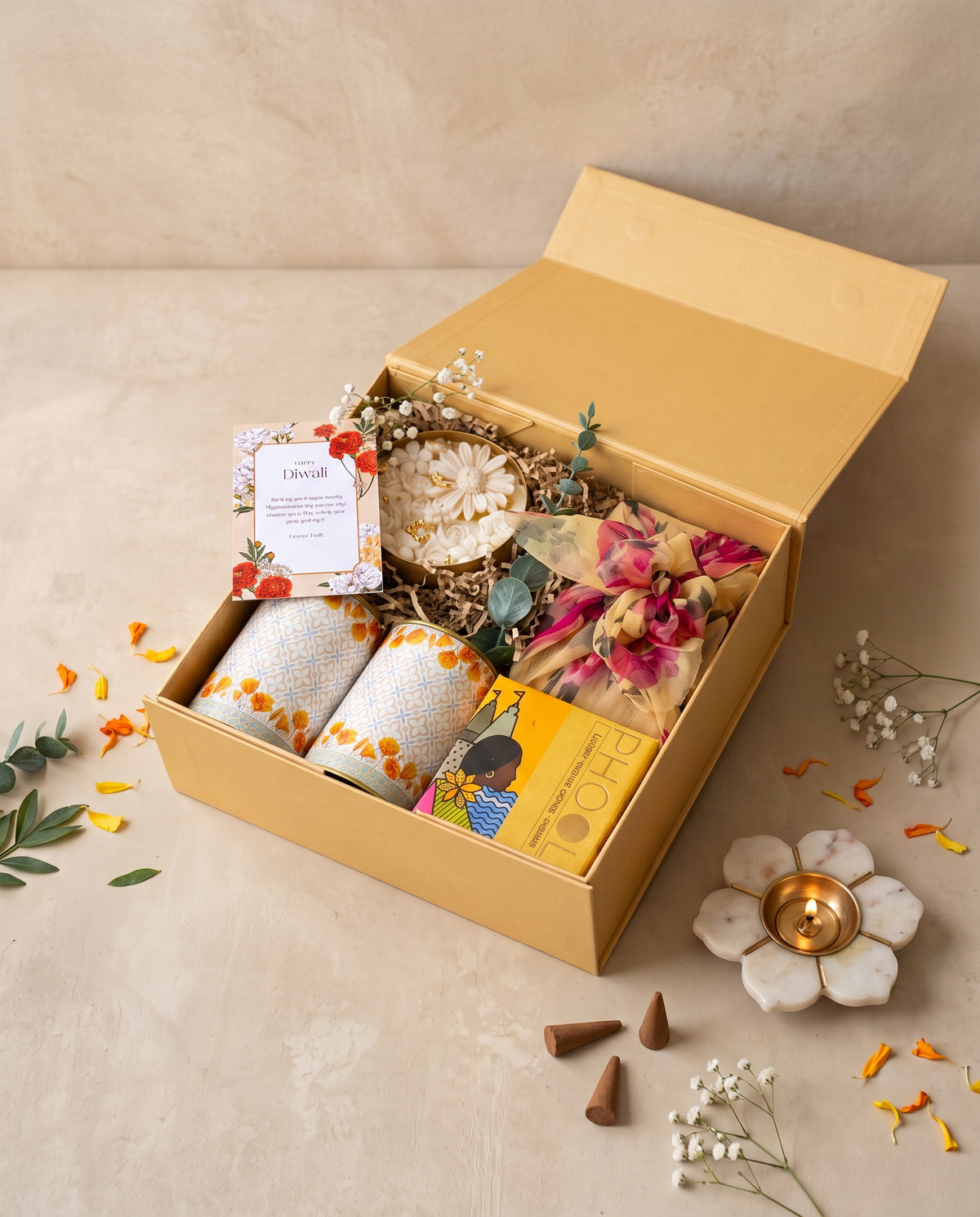Marigold Mithai Hamper with decorative candles, incense, and festive gifts for Diwali celebrations.
