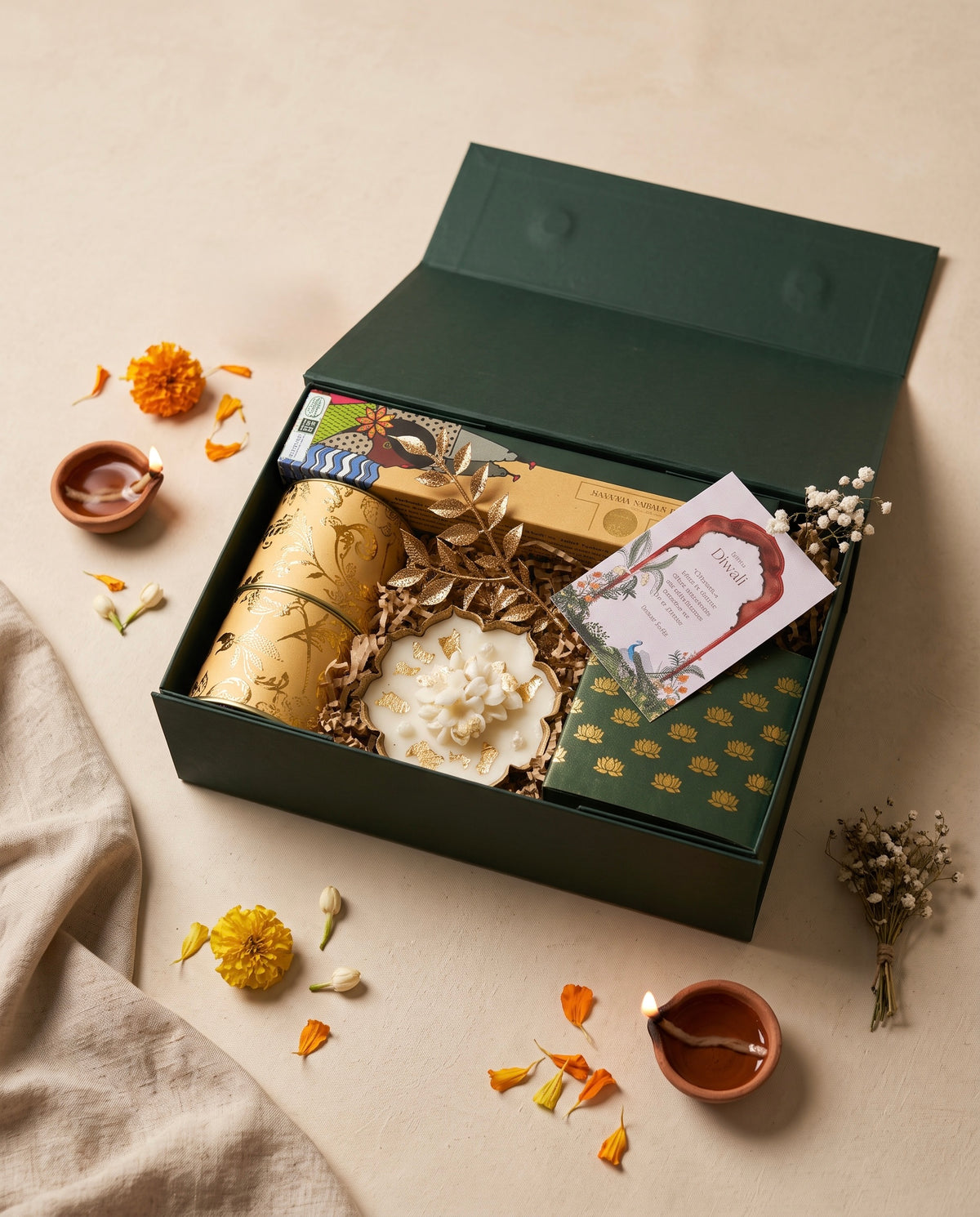 Lotus Light Hamper showcasing festive sweets, floral candle, and incense for Diwali celebrations.