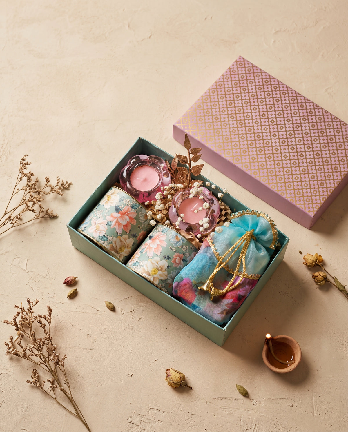 Little Lights Diwali Box featuring floral tealight holders and decorative packaging.