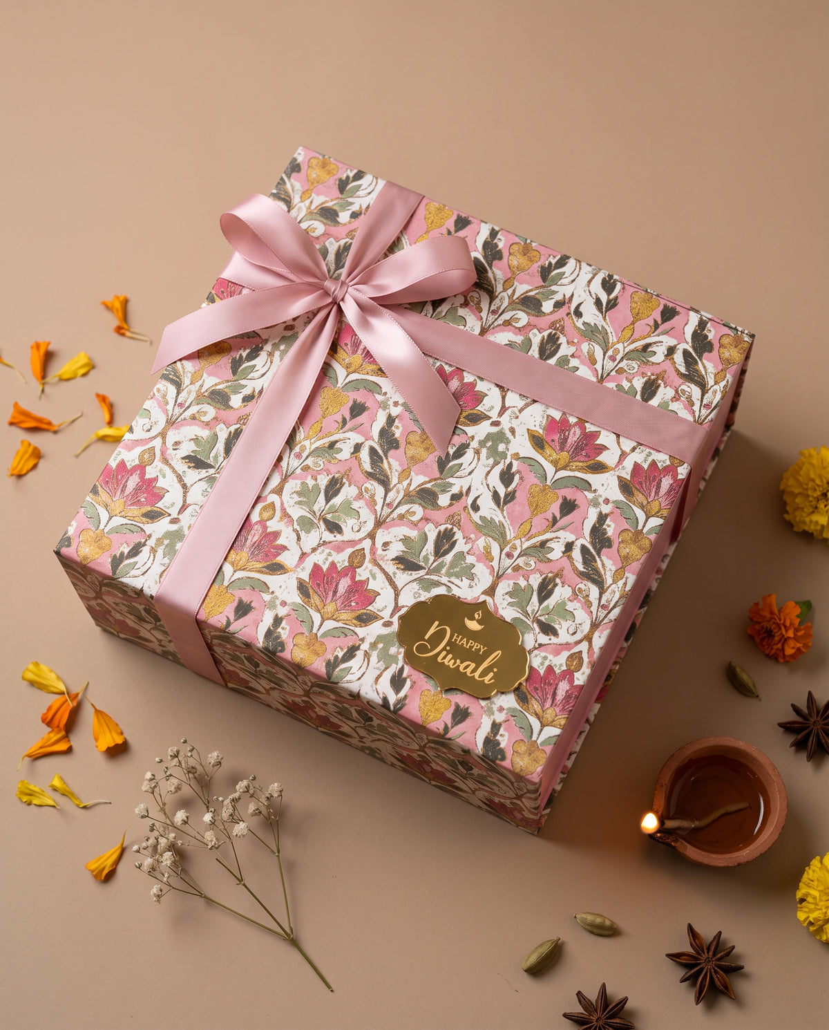 Pink Lotus Hamper beautifully wrapped in floral design with a pink ribbon for Diwali.