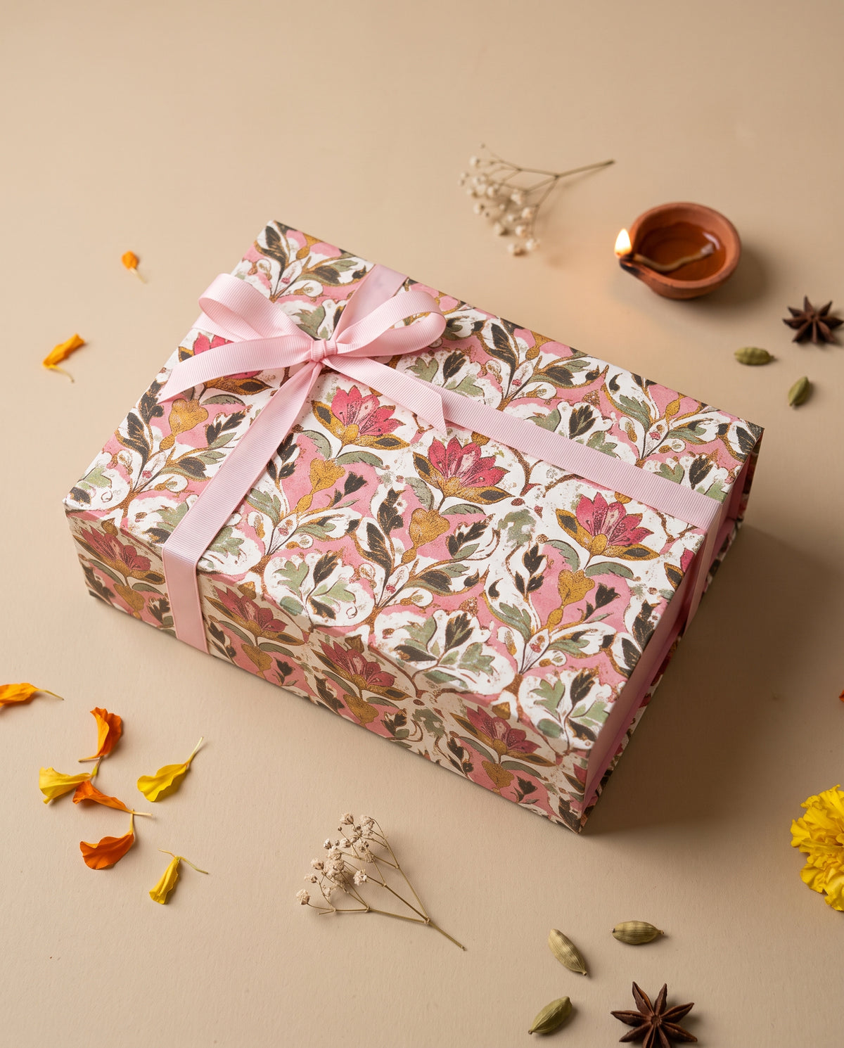 Rose Glow Diwali Hamper beautifully wrapped with floral design and pink ribbon, perfect for Deepavali gifting.