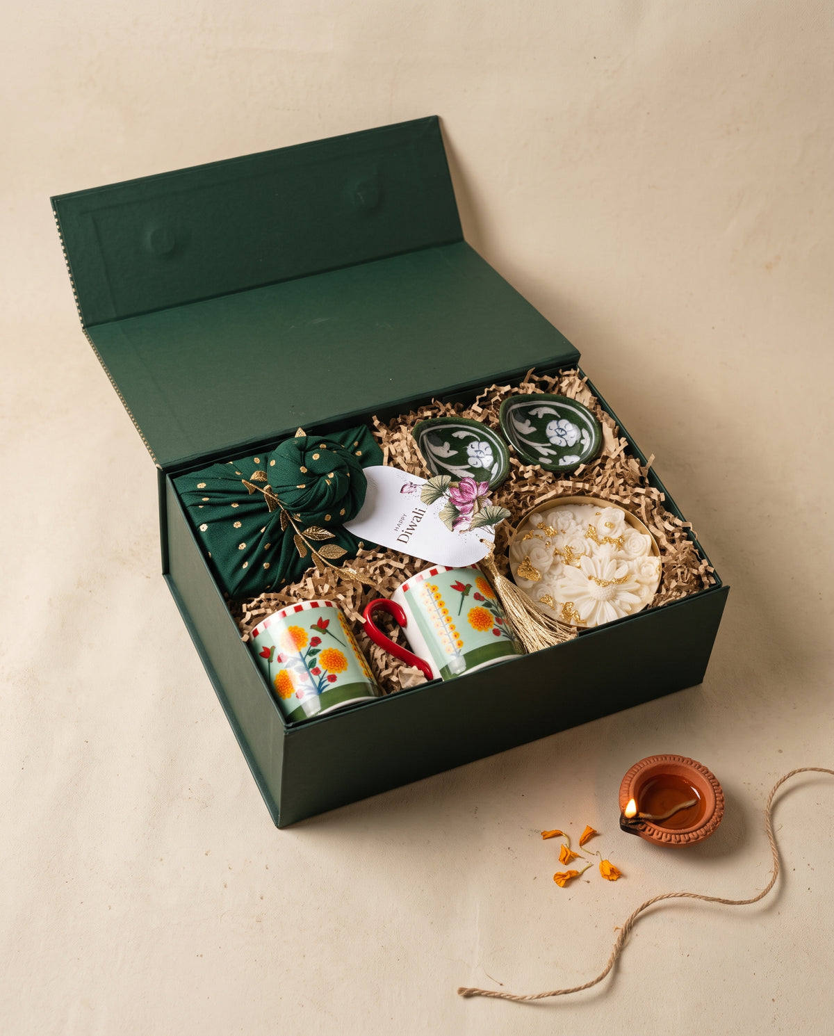 Rani Bagh Diwali Box featuring mugs, diyas, and floral designs, perfect for Diwali celebrations.