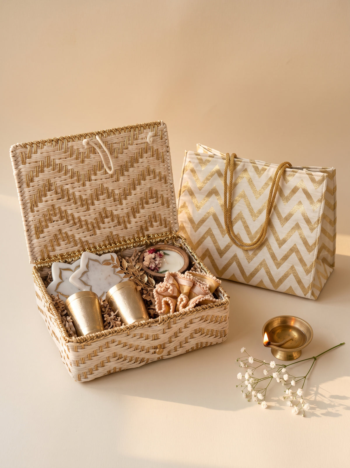 Shubh Labh Keepsake Hamper - luxury Diwali brass gift hamper with intricate items in a woven basket.