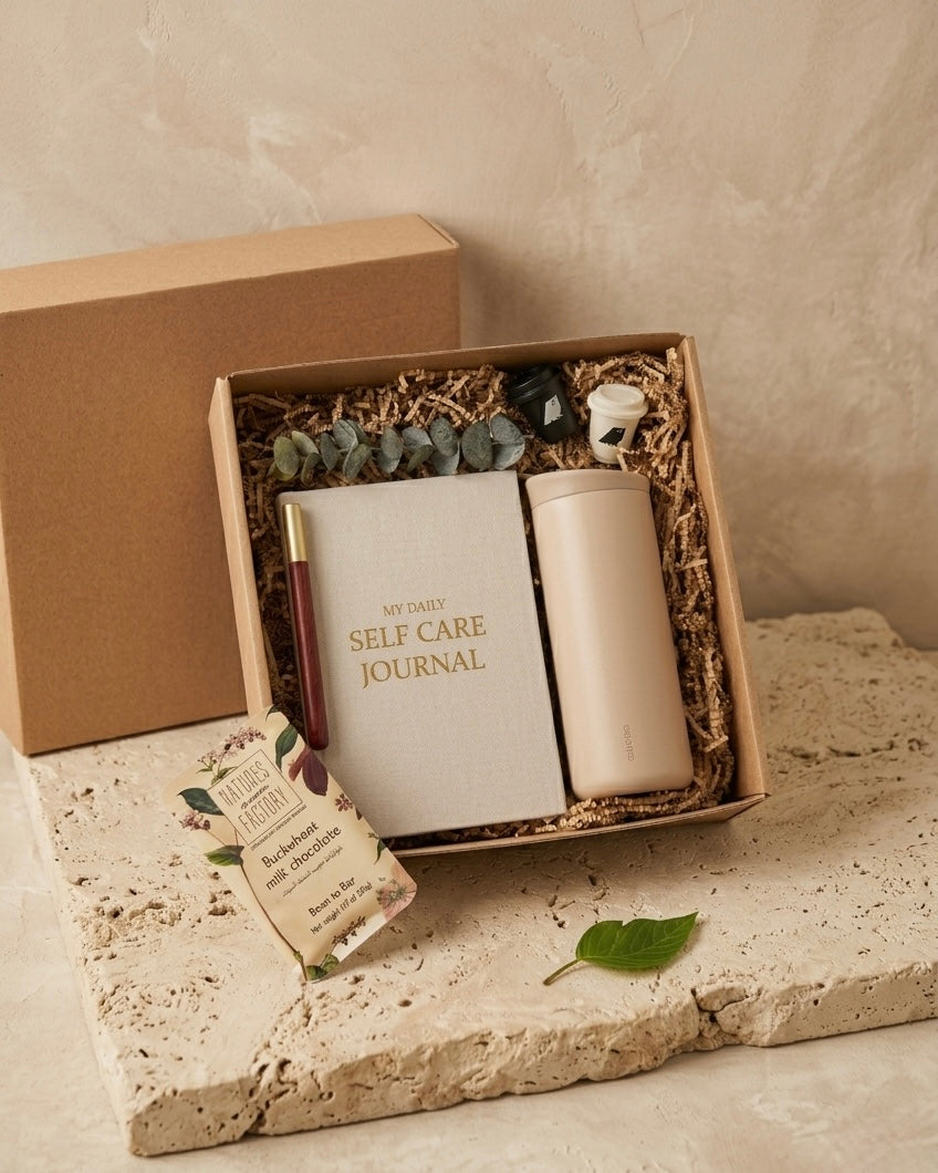 Wellness Gift Box Dubai contents – self care journal, candles and buckwheat milk chocolate bar
