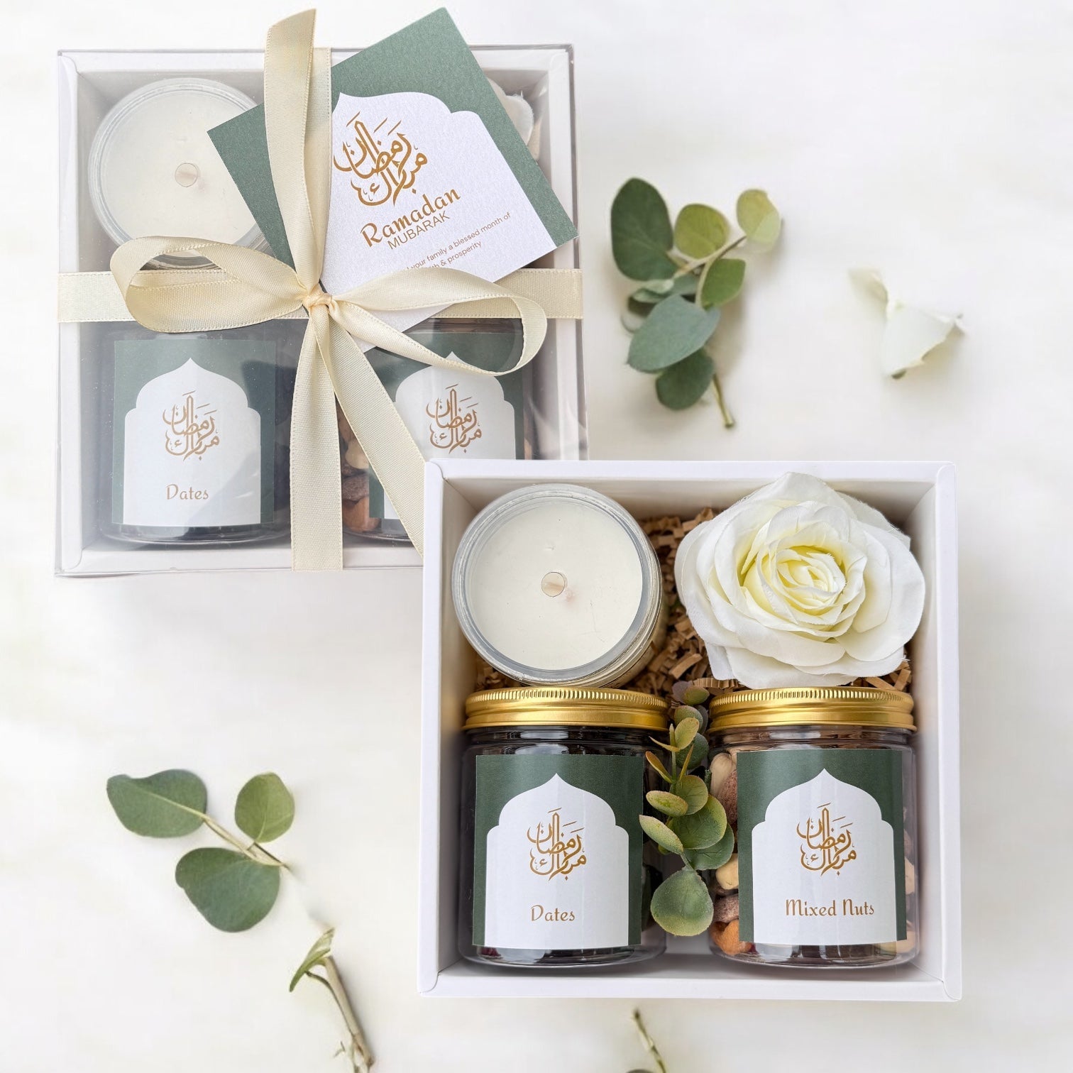 Minimal gift set featuring scented candle, jar of dates, and mixed nuts for special occasions.