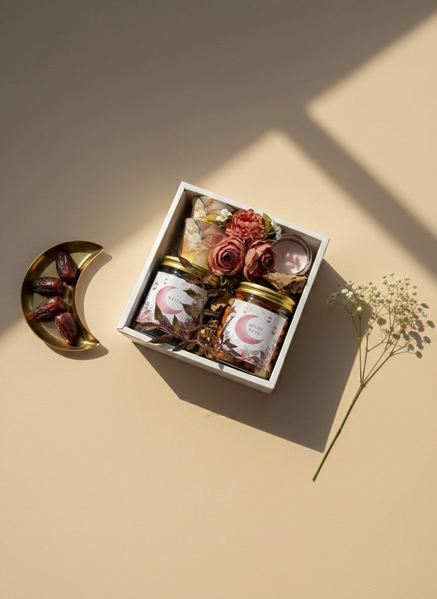 Palm Pastel Box featuring a jar of dates, mixed nuts, Kahwa cups, and a mini candle.