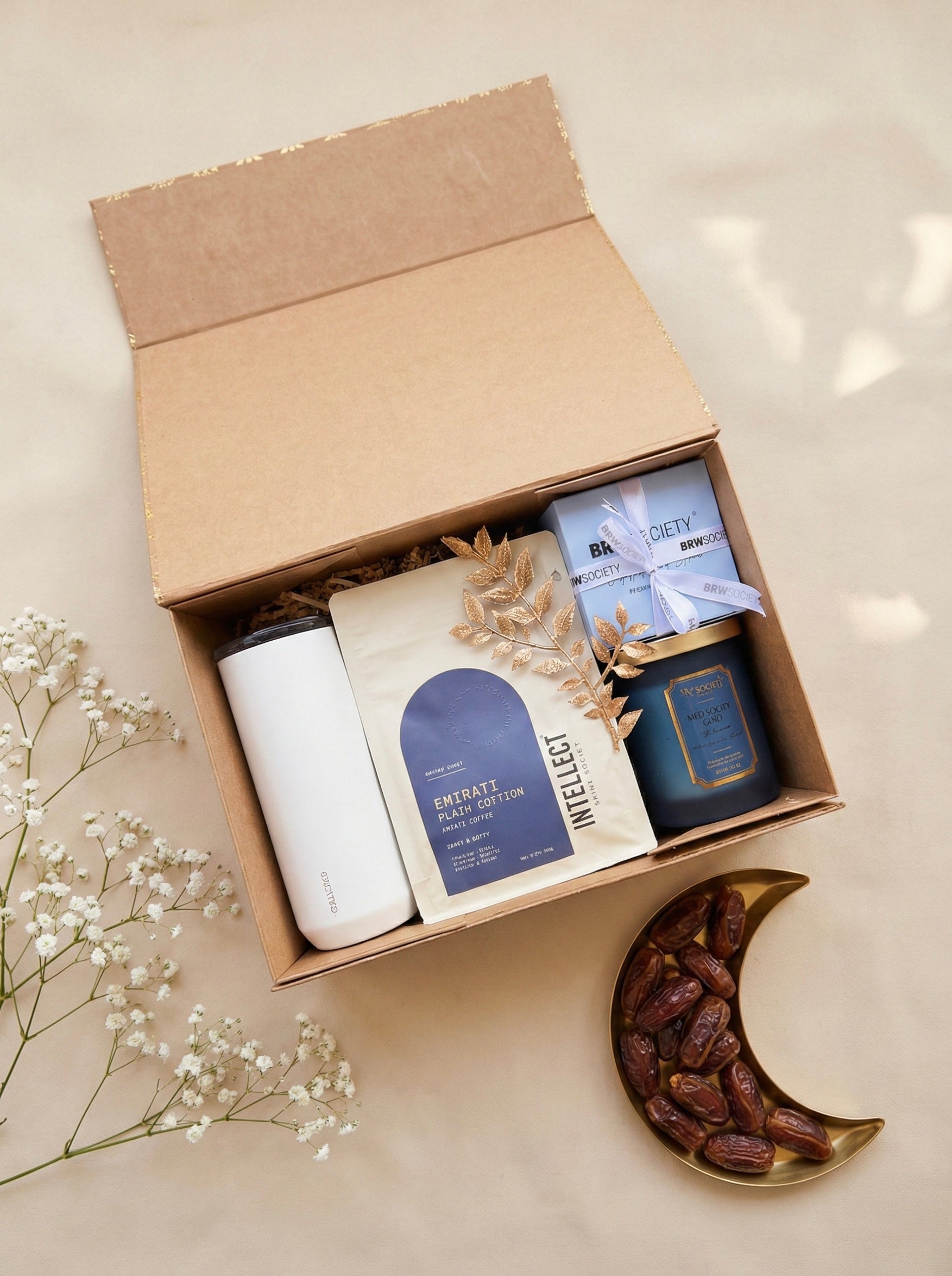 Perfect Pour Box containing premium coffee and tea gift box with tumbler, tea bags, coffee, and a candle.