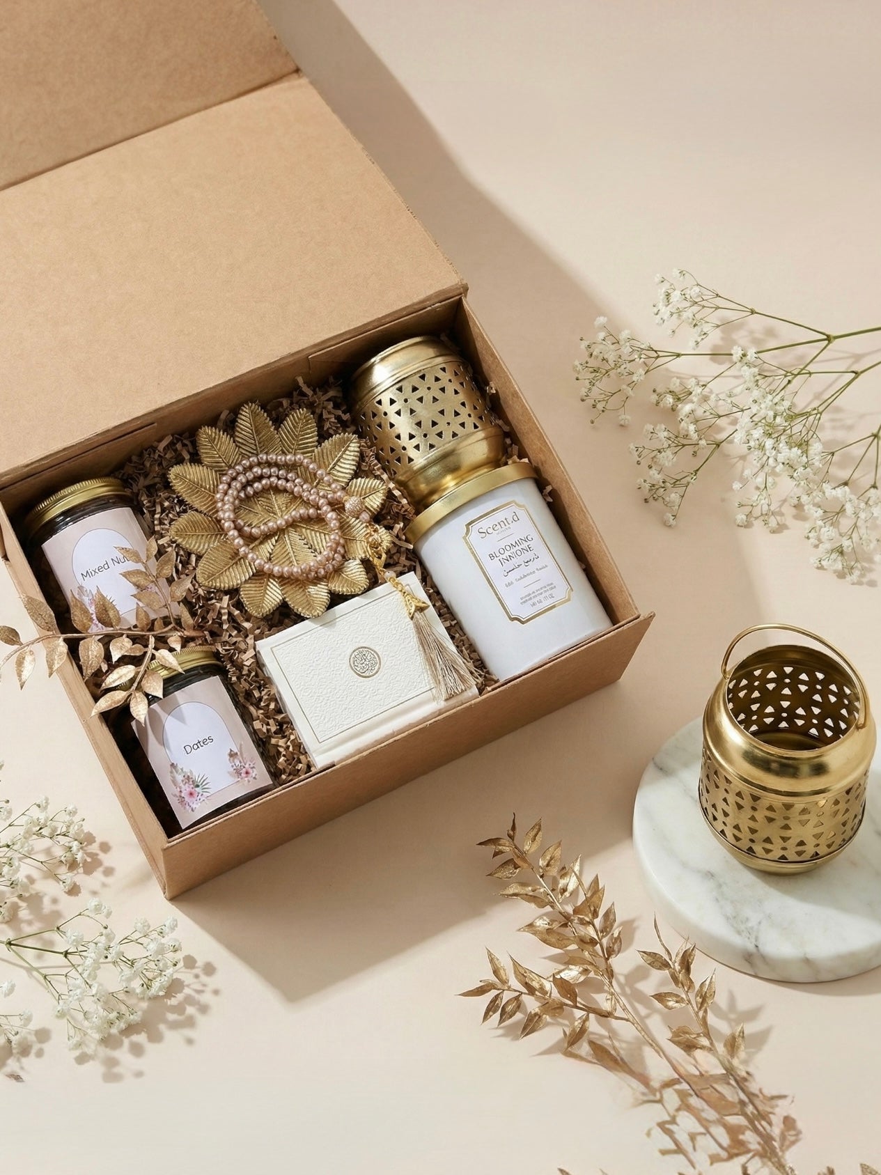 Royal Saffron Box featuring scented candles, golden tray, Quran Tasbih, lantern, and jars of mixed nuts and dates.