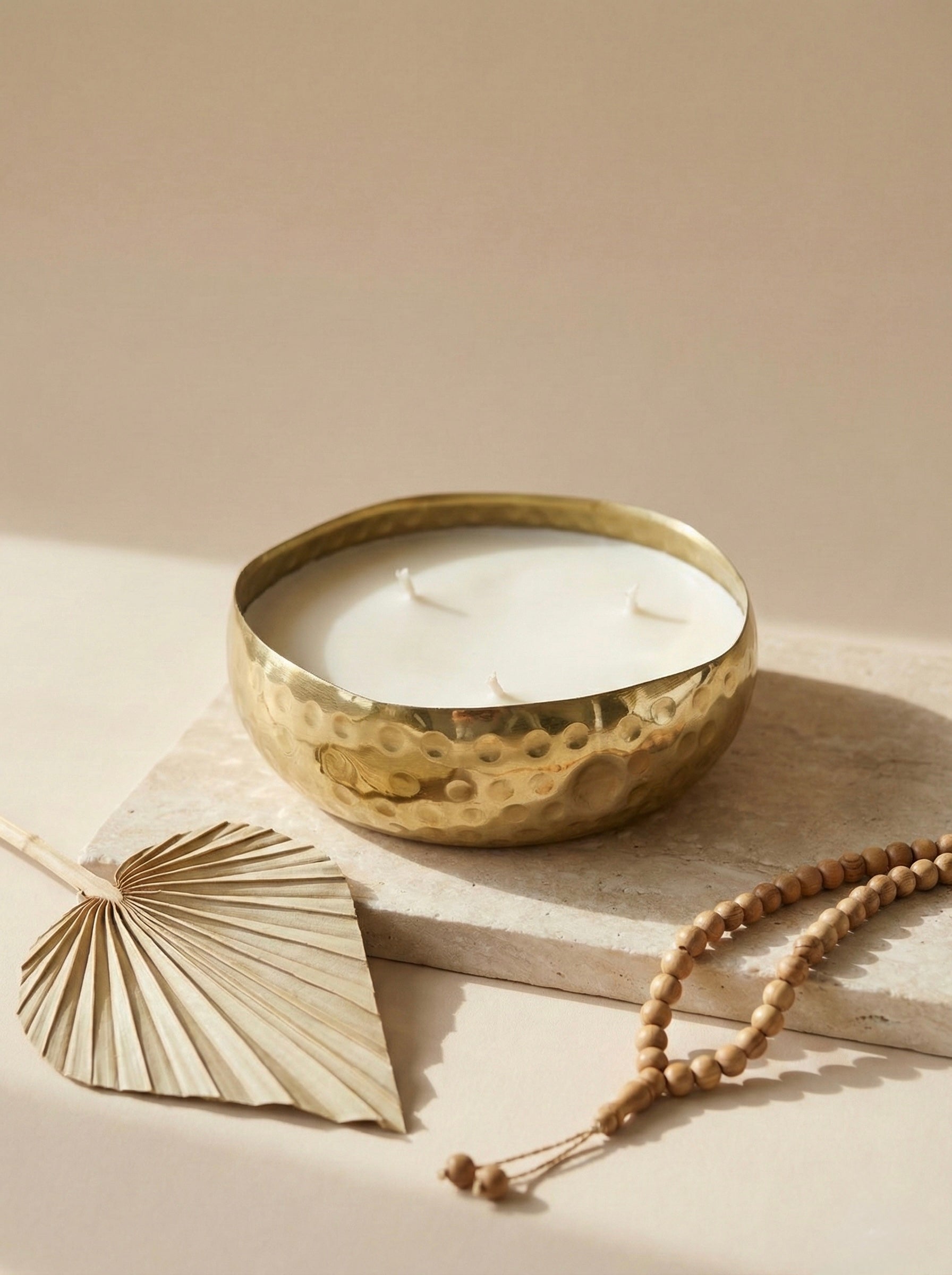 Saffron spice gift box featuring a premium scented metal candle with three wicks on a natural surface.