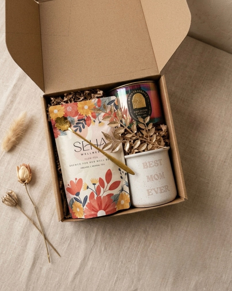 Best Mom Ever gift box featuring herbal tea, candle, and mug in a beautifully arranged package.