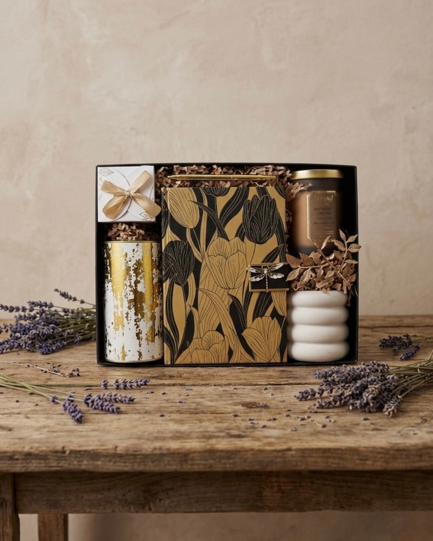 The Golden Dusk Box featuring a botanical journal, luxury candle, and more, a premium gift box Dubai.
