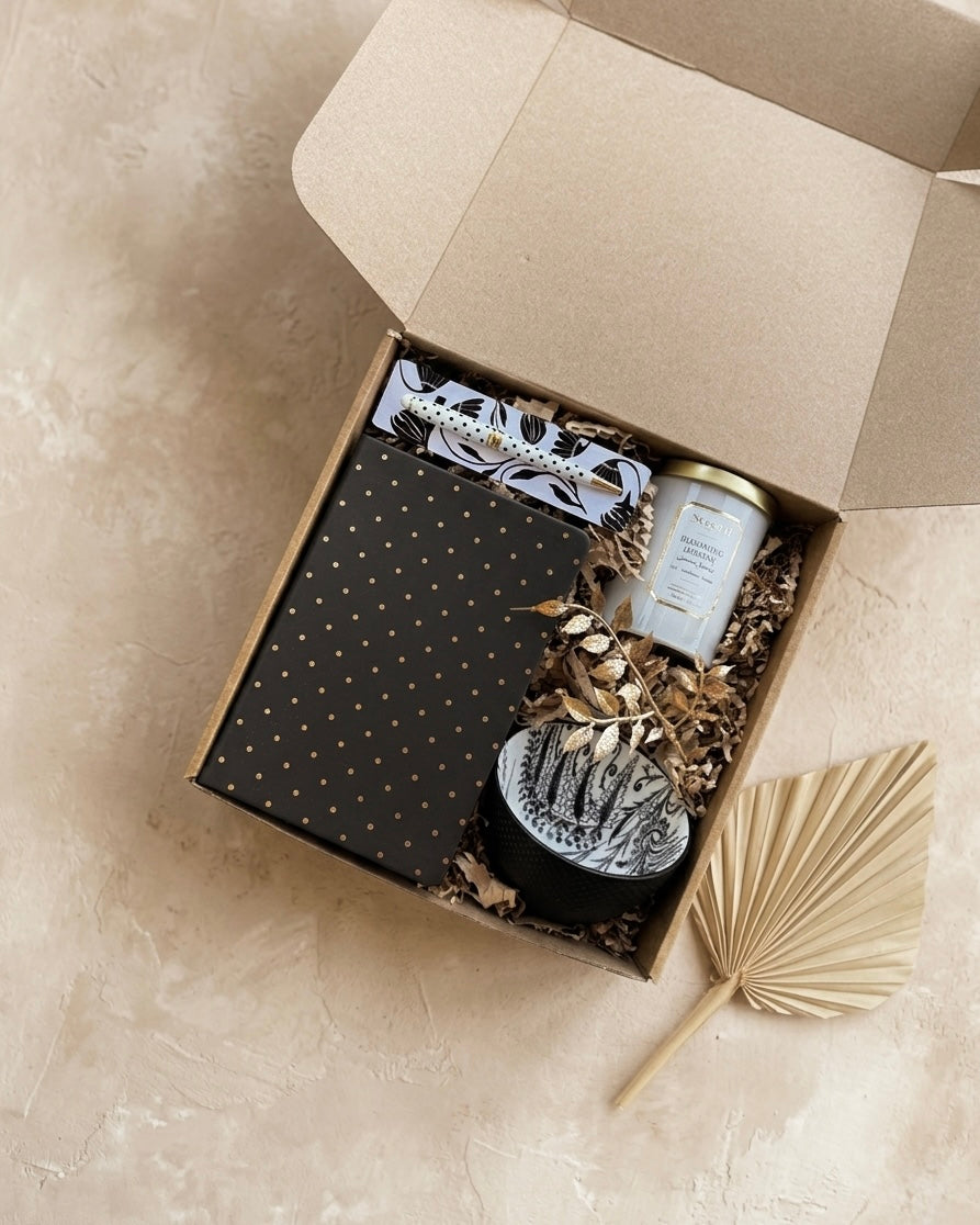 Polka Dot Elegance gift box featuring notebook, metallic pen, candle, and ceramic mug in eco-friendly kraft box.
